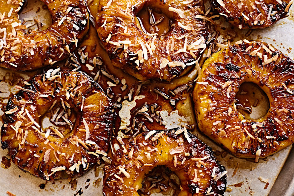 Grilled pineapple rings caramelized with piña colada glaze