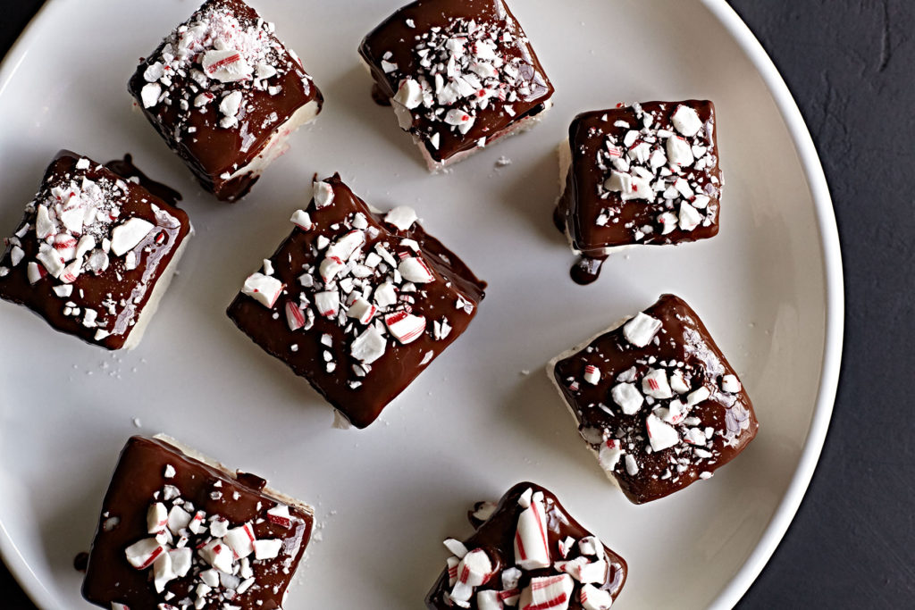 Homemade peppermint chocolate marshmallows on a plate.