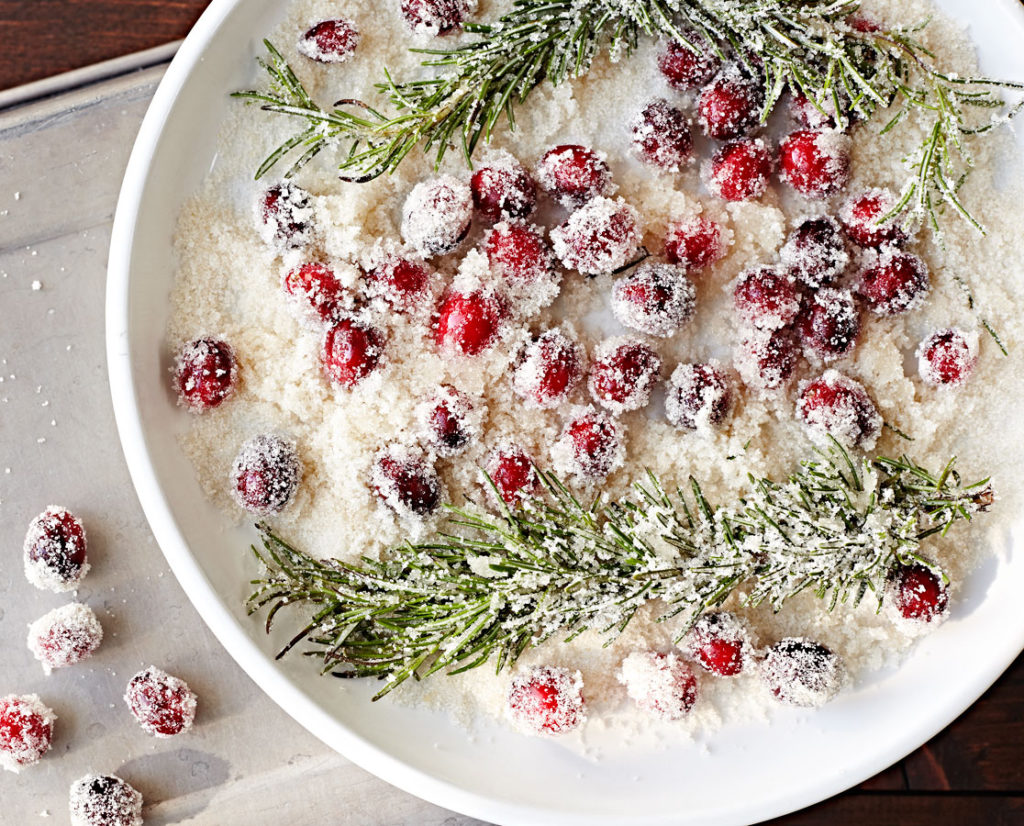 Cranberries and rosemary in sugar