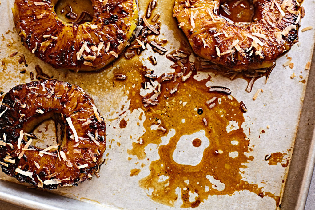 Grilled pineapple rings caramelized with piña colada glaze