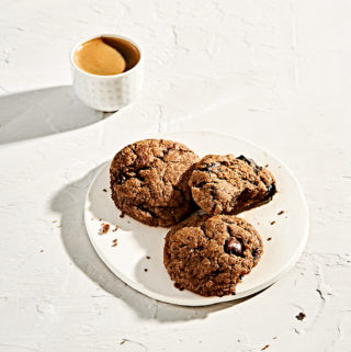 Overhead view of almond butter tahini grain-free chocolate chip cookies and espresso.