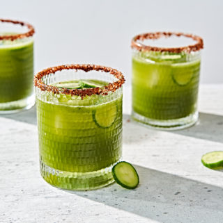 Picante spicy cucumber cilantro and lime margarita in a tajin spice rimmed glasses.